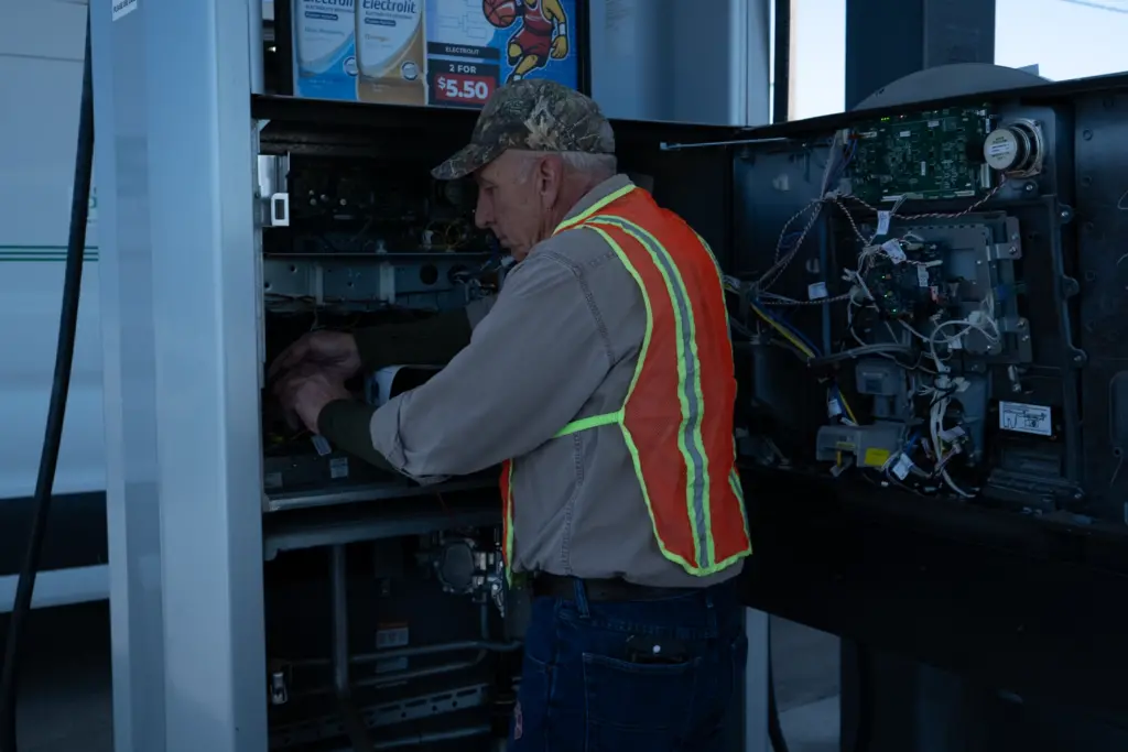 Neumayer employee working at a gas dispenser.