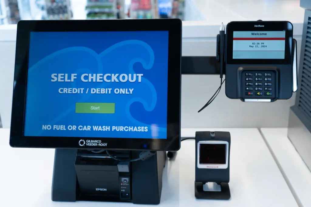 Self check out station with a scanner and a credit card scanner.