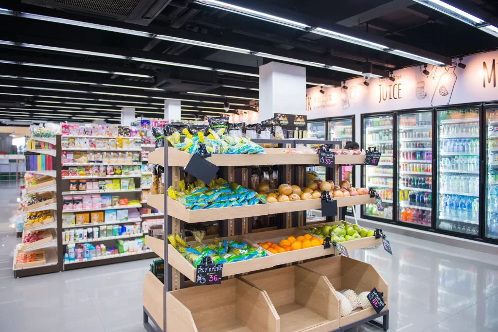 A grocery store with fruits and vegetables on display.